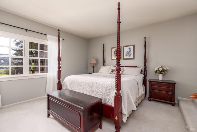 bedroom featuring light colored carpet