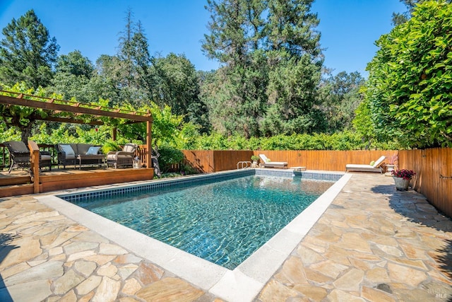 view of pool with an outdoor hangout area and a diving board