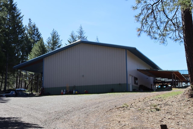 view of side of property featuring a carport