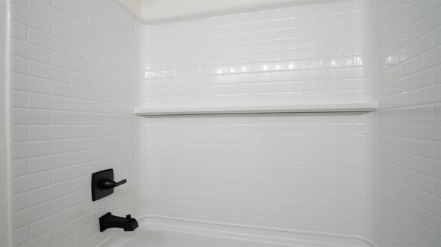 details with tiled shower / bath combo