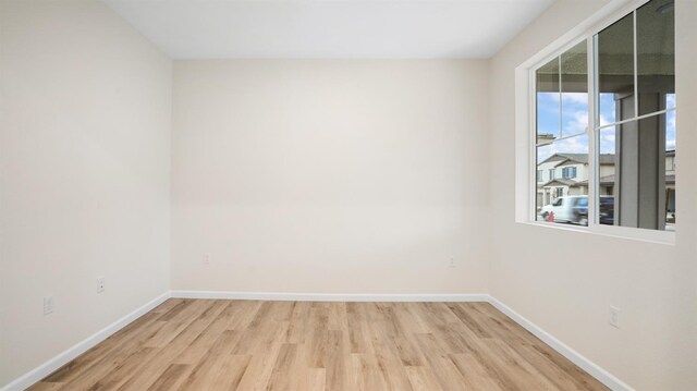 unfurnished room featuring wood-type flooring