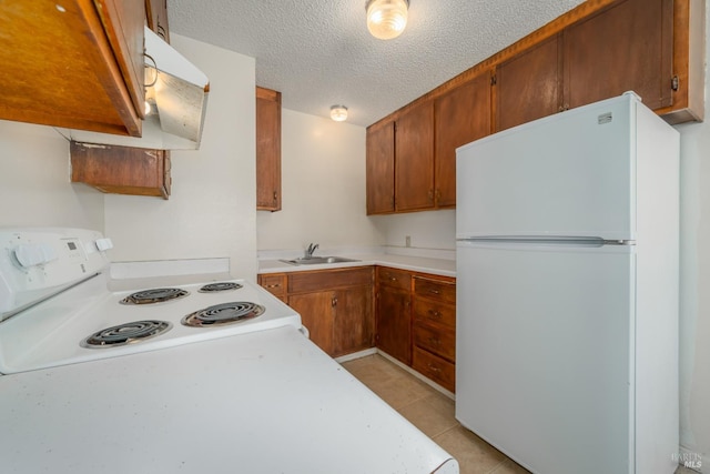 15 Royale Ave, Lakeport, CA 95453 - kitchen featuring light tile patterned floors, sink, white appliances, a textured ceiling, and ventilation hood