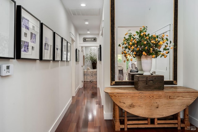 hall with dark hardwood / wood-style flooring