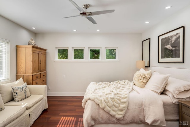 bedroom with ceiling fan and dark hardwood / wood-style floors