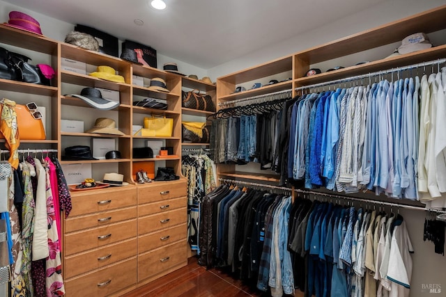 walk in closet with dark hardwood / wood-style flooring