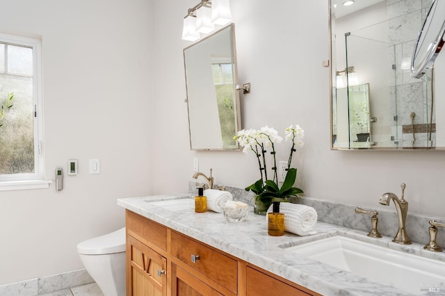 bathroom featuring tile patterned flooring, an enclosed shower, vanity, and toilet