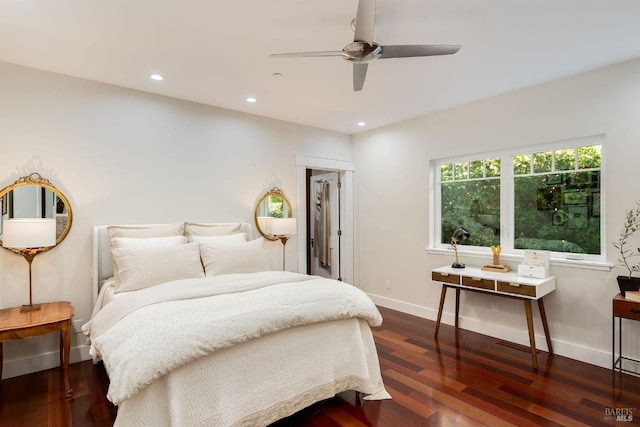 bedroom featuring ceiling fan and dark hardwood / wood-style floors