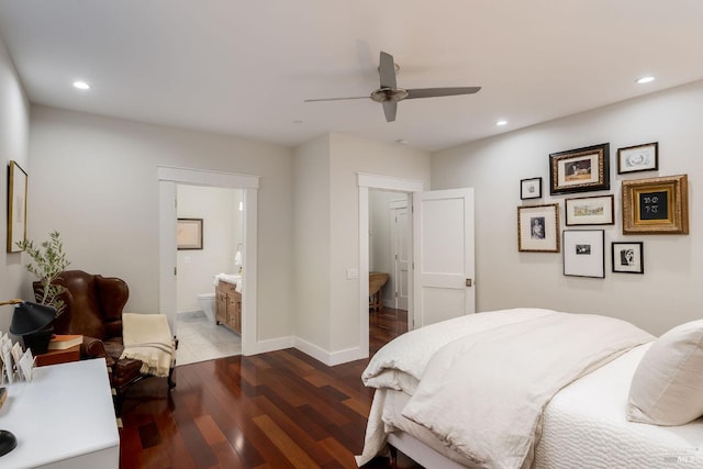 bedroom featuring ceiling fan, ensuite bathroom, and hardwood / wood-style flooring