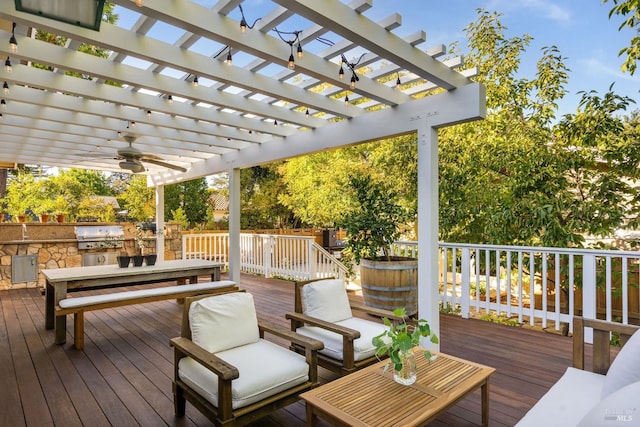 wooden terrace with grilling area, area for grilling, a pergola, and ceiling fan