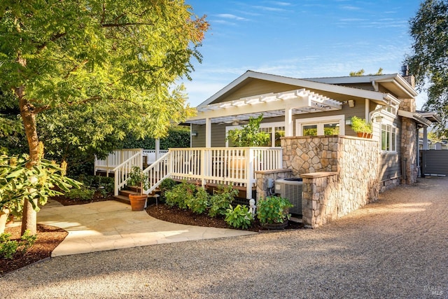 view of front of home featuring cooling unit and a wooden deck