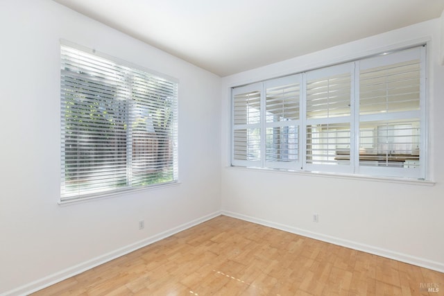 spare room featuring light hardwood / wood-style floors