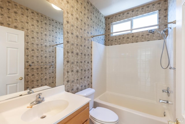 full bathroom featuring vanity, shower / washtub combination, and toilet