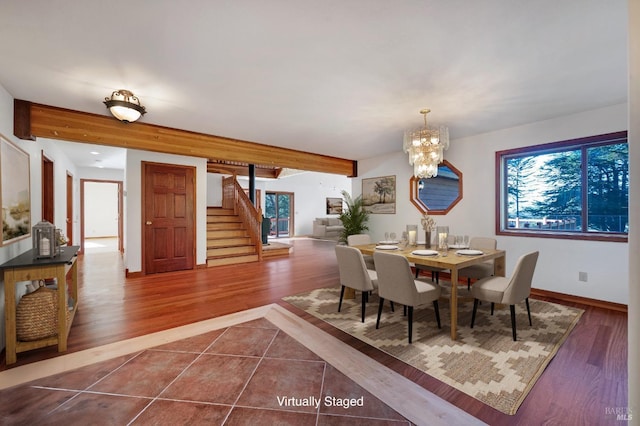 3925 Bay Hill Rd, Bodega Bay, CA 94923 - dining room featuring beam ceiling, baseboards, an inviting chandelier, stairway, and dark tile patterned flooring