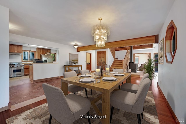 dining room featuring a chandelier and light wood-type flooring