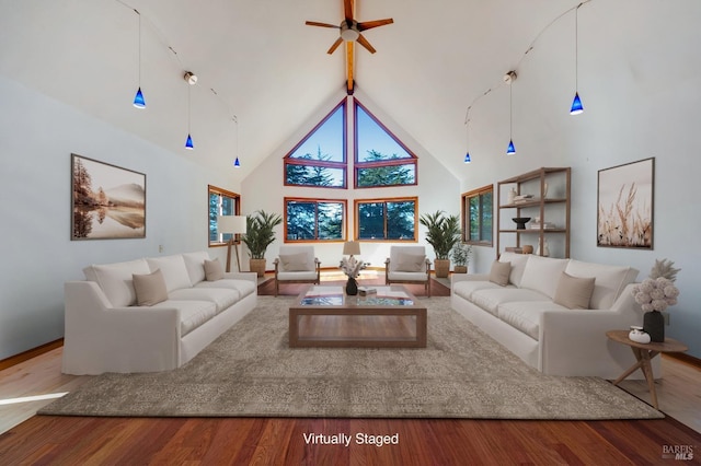 3925 Bay Hill Rd, Bodega Bay, CA 94923 - living room featuring high vaulted ceiling, a ceiling fan, wood finished floors, beamed ceiling, and baseboards