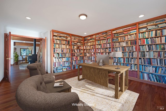 3925 Bay Hill Rd, Bodega Bay, CA 94923 - office space with wall of books, a wood stove, wood finished floors, and recessed lighting