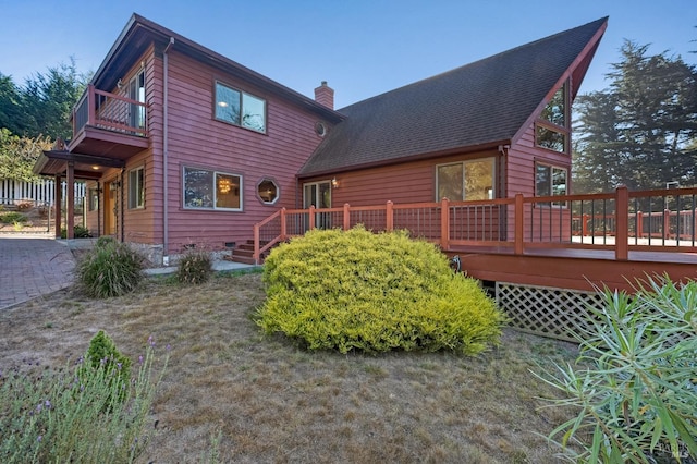 3925 Bay Hill Rd, Bodega Bay, CA 94923 - back of property featuring a chimney, a balcony, and a deck