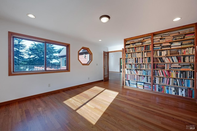 spare room with hardwood / wood-style floors