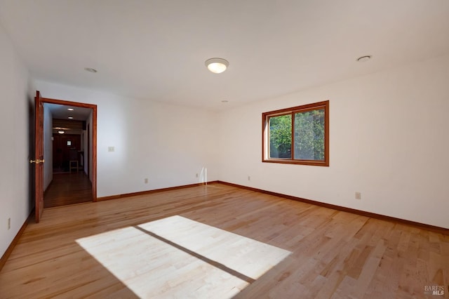 unfurnished room featuring light hardwood / wood-style flooring