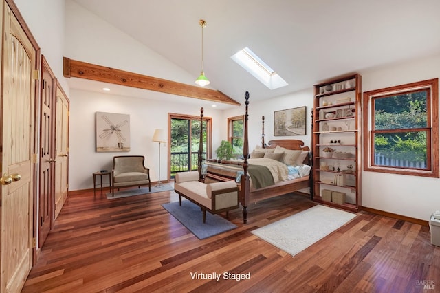 bedroom with dark hardwood / wood-style floors, a skylight, and high vaulted ceiling