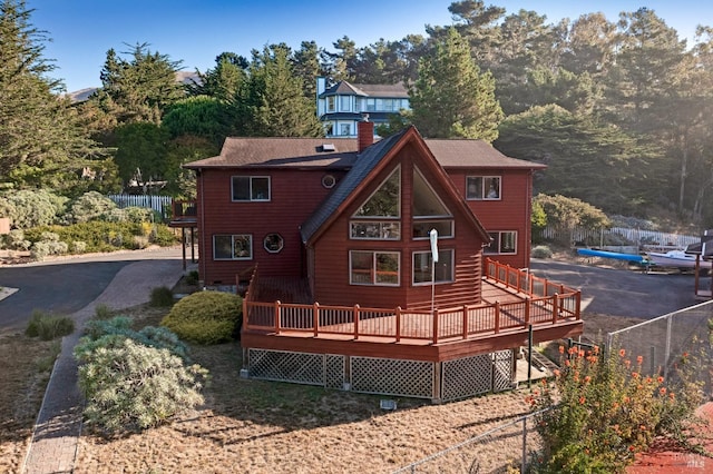 back of house featuring a wooden deck