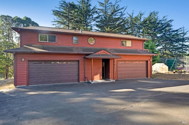 3925 Bay Hill Rd, Bodega Bay, CA 94923 - view of front of property featuring aphalt driveway, roof with shingles, and a garage