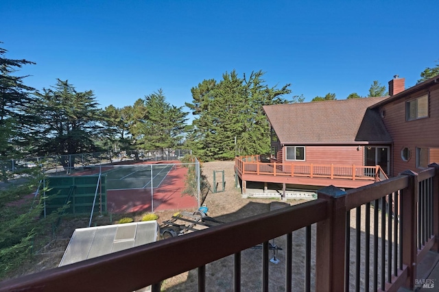 deck featuring tennis court