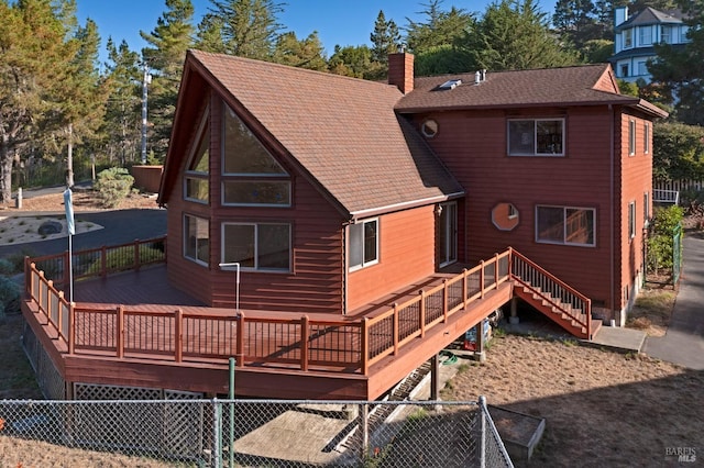 3925 Bay Hill Rd, Bodega Bay, CA 94923 - back of house with stairway, a chimney, roof with shingles, and a deck