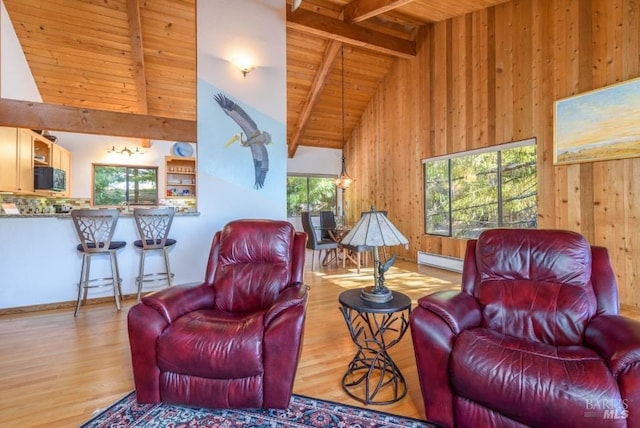 38120 Ocean Ridge Dr, Gualala, CA 95445 - living room with wood ceiling, a baseboard heating unit, high vaulted ceiling, wooden walls, and wood finished floors