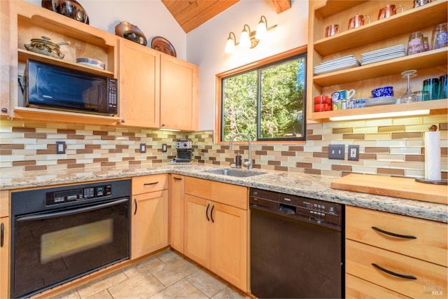 kitchen with black appliances, light stone countertops, decorative backsplash, sink, and lofted ceiling