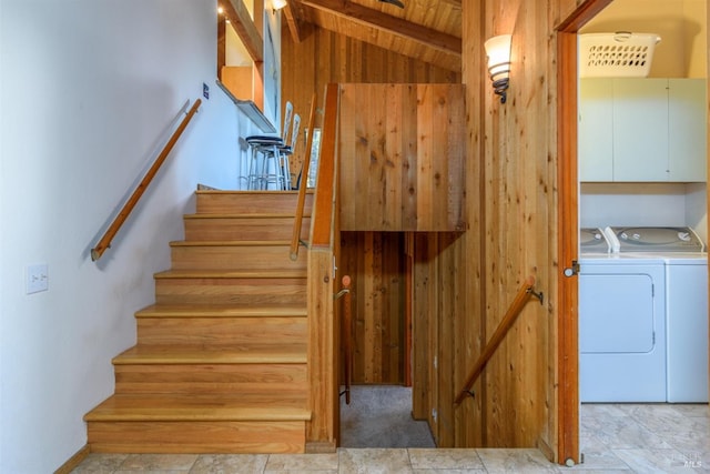 staircase with vaulted ceiling with beams and washer and clothes dryer