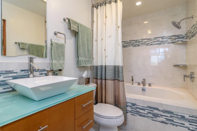 full bathroom with toilet, vanity, and shower / bath combo with shower curtain