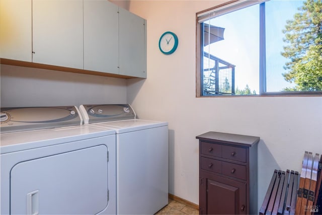 laundry room with cabinets and separate washer and dryer