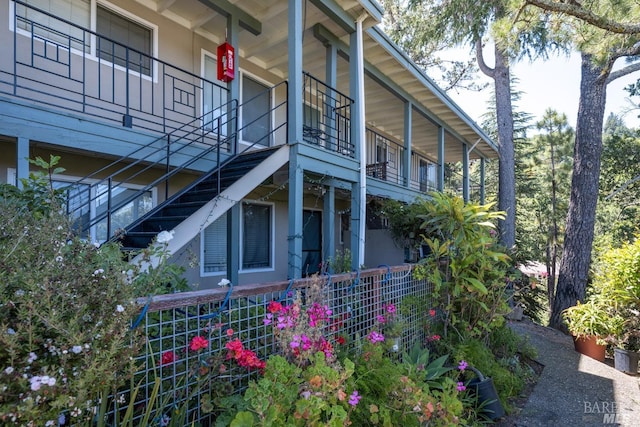 view of side of home with a balcony