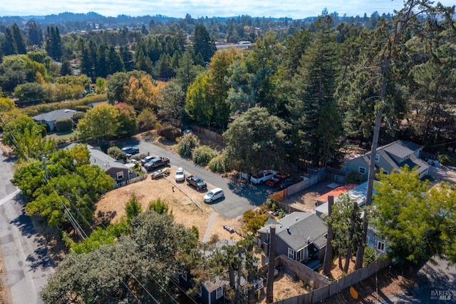 bird's eye view featuring a wooded view