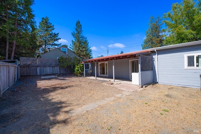 rear view of house featuring a patio area