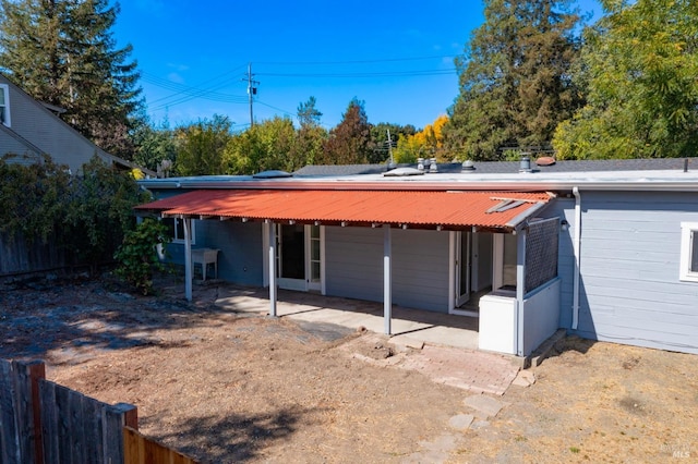 rear view of property featuring a patio area