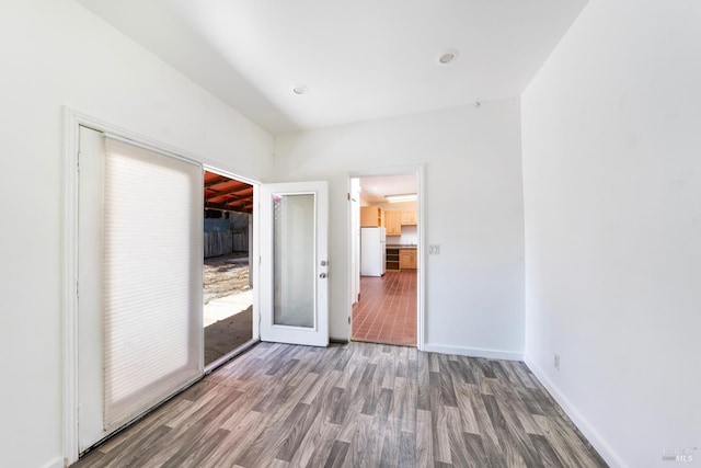 unfurnished room featuring hardwood / wood-style flooring and french doors