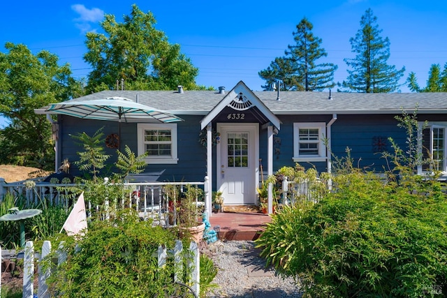 view of front of house featuring a shingled roof