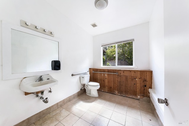 bathroom featuring tile patterned flooring and toilet