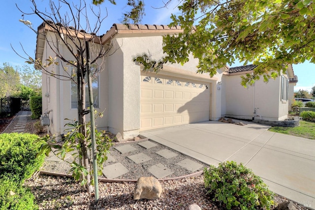 view of side of property with a garage