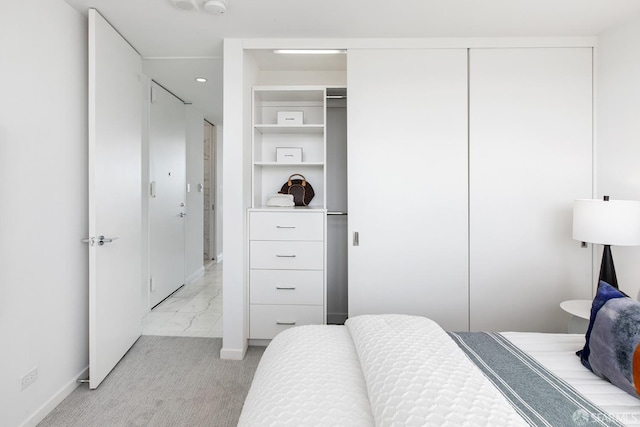 bedroom featuring light colored carpet