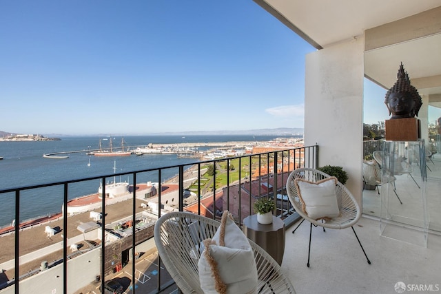 balcony featuring a water view