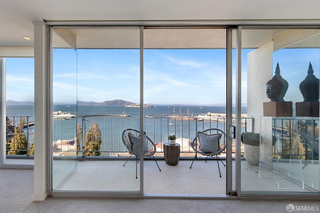 interior space featuring a water and mountain view