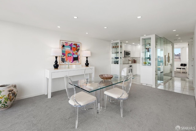 dining area with light carpet