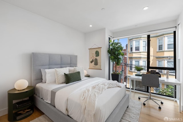 bedroom with light hardwood / wood-style flooring