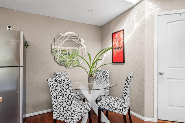 dining room with wood-type flooring