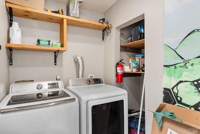 clothes washing area featuring separate washer and dryer