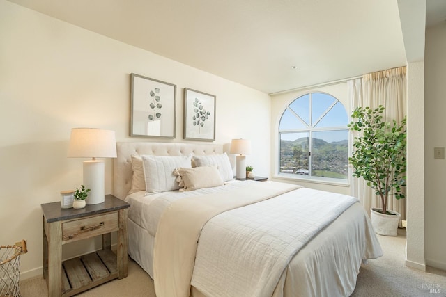 carpeted bedroom featuring a mountain view