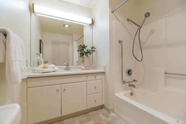 bathroom with vanity and  shower combination